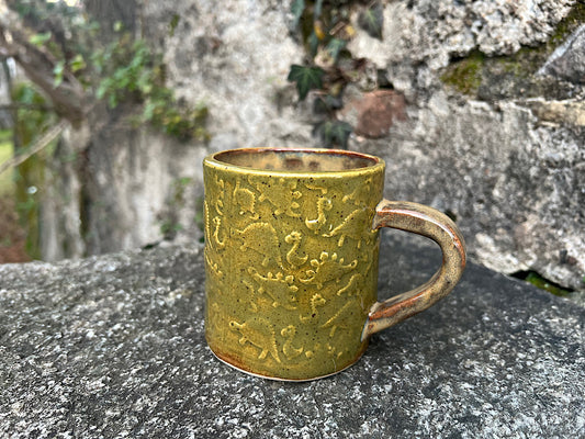 Tazza da tè in ceramica verde con dinosauri